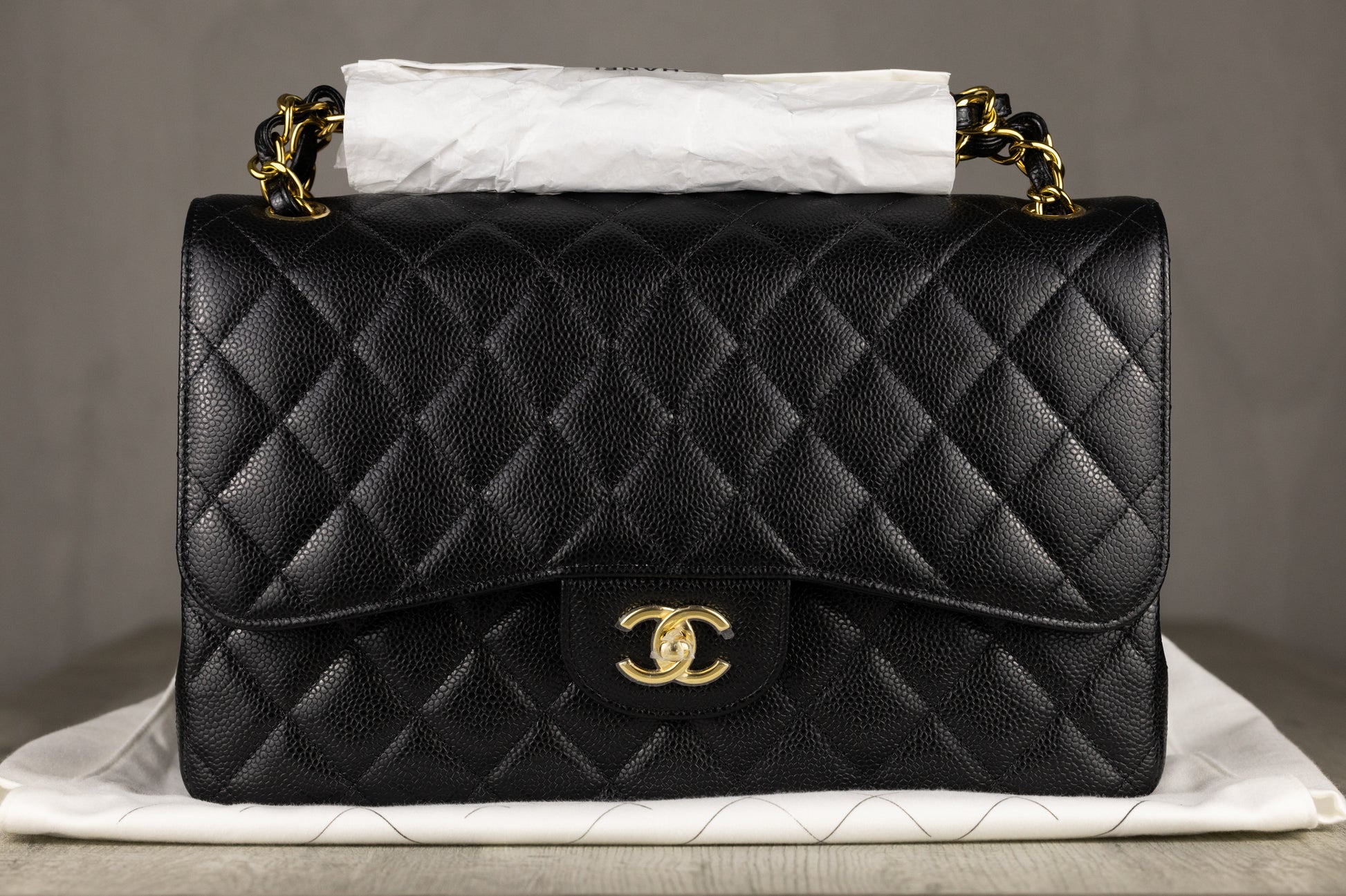 Chanel A58600 Y01864 C3906 Jumbo Classic Double Flap Bag in Black Quilted Caviar Leather with Gold-Tone Hardware