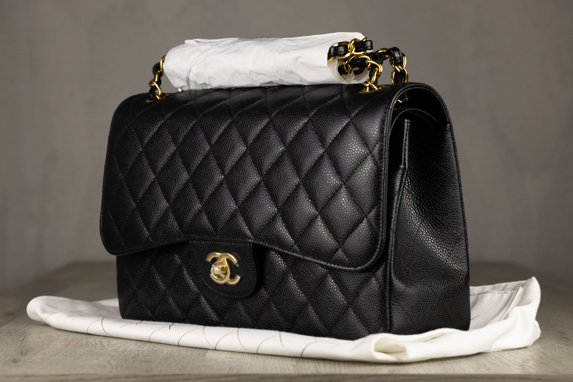 Chanel A58600 Y01864 C3906 Jumbo Classic Double Flap Bag in Black Quilted Caviar Leather with Gold-Tone Hardware