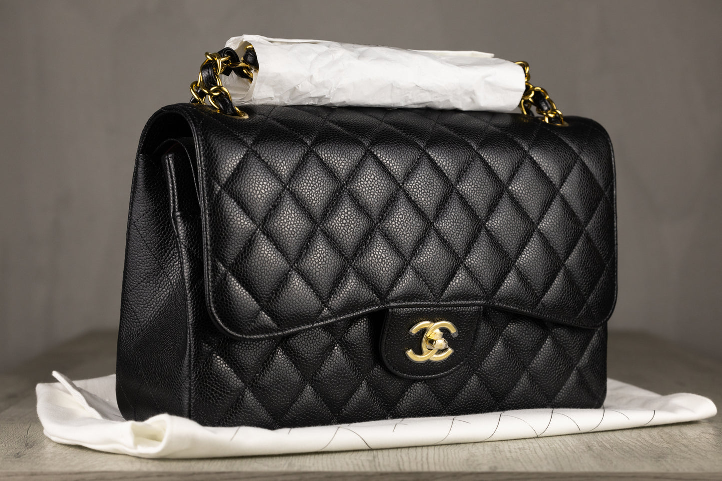 Chanel A58600 Y01864 C3906 Jumbo Classic Double Flap Bag in Black Quilted Caviar Leather with Gold-Tone Hardware