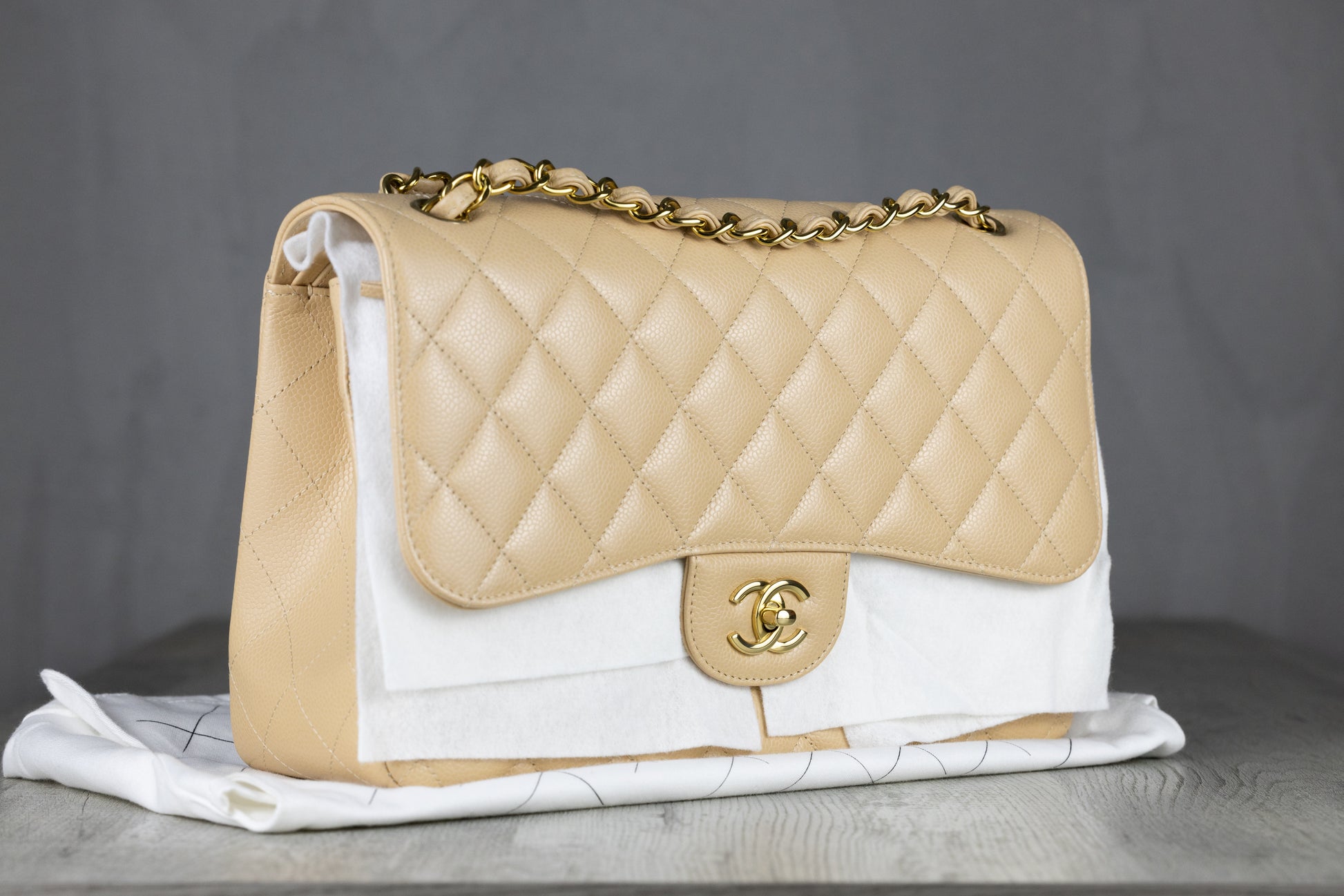 Chanel A58600 Y01864 Jumbo Classic Double Flap Bag in Beige Quilted Caviar Leather with Gold-Tone Hardware